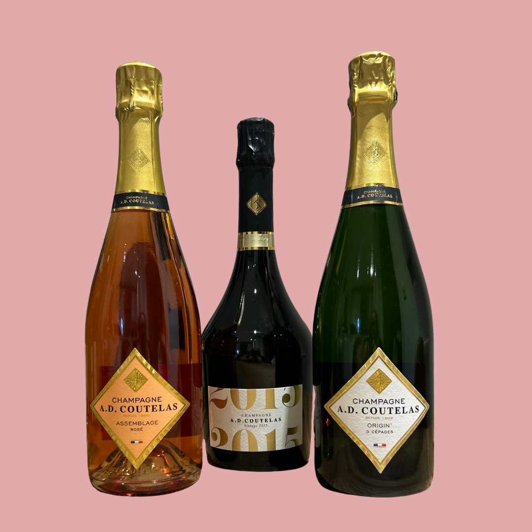 three coutelas vintage champagne bottles